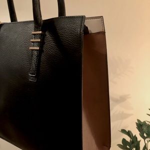 Black and brown call it spring tote bag.